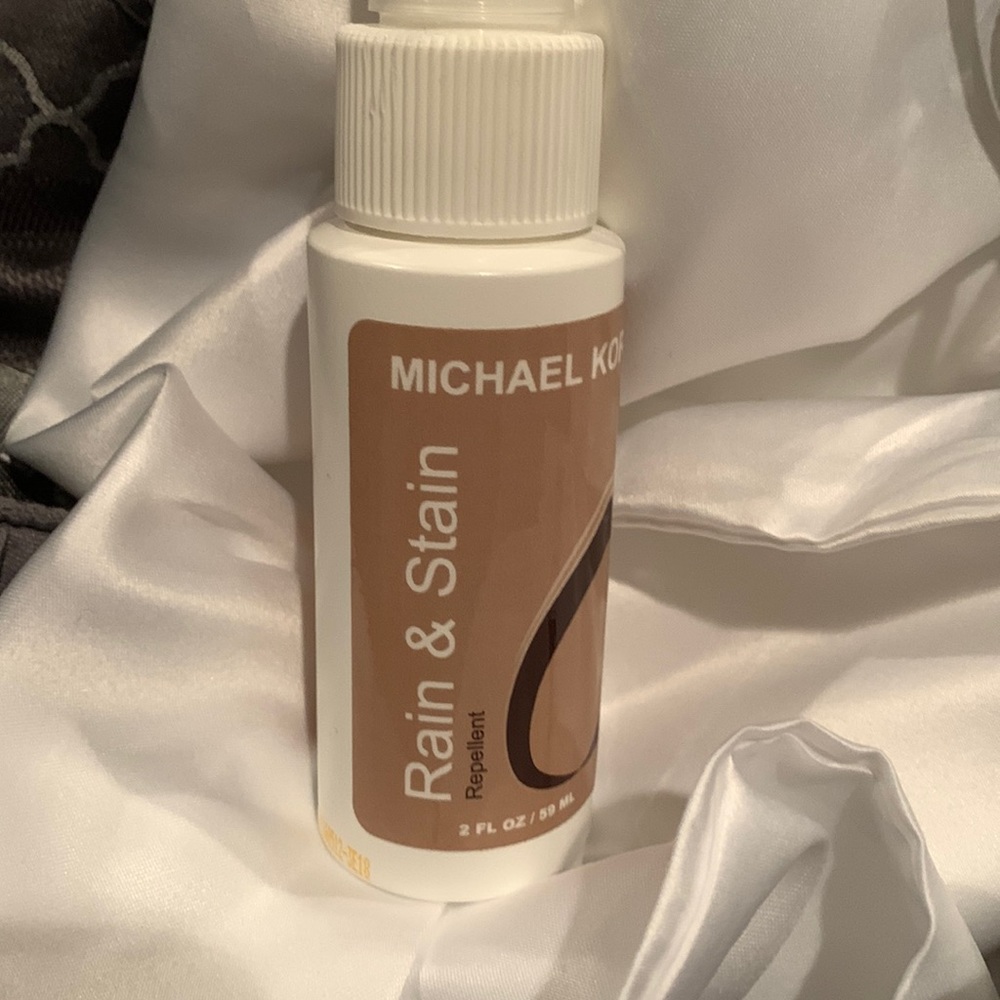 Michael Kors Rain & Shine. Protects fine leather, suede, nubuck, fabric